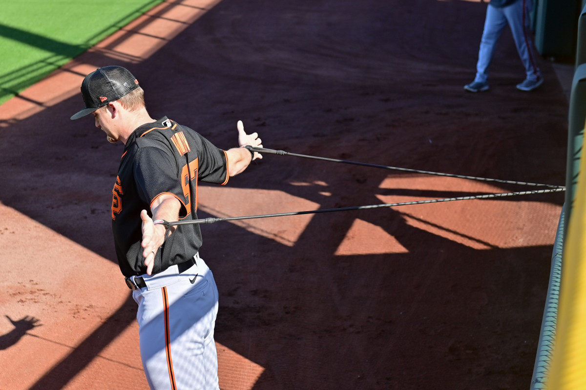 SF Giants starting pitcher Keaton Winn warms up during a Spring Training workout. (2023)